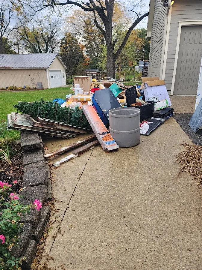 Dumpster being loaded with debris for Commercial Dumpster Rental in Senoia